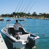man driving boat with 6 rods in a rocket launcher